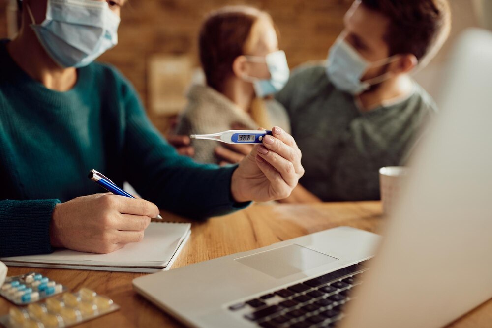 Closeup of woman consulting with doctor about daughter's fever via video call
